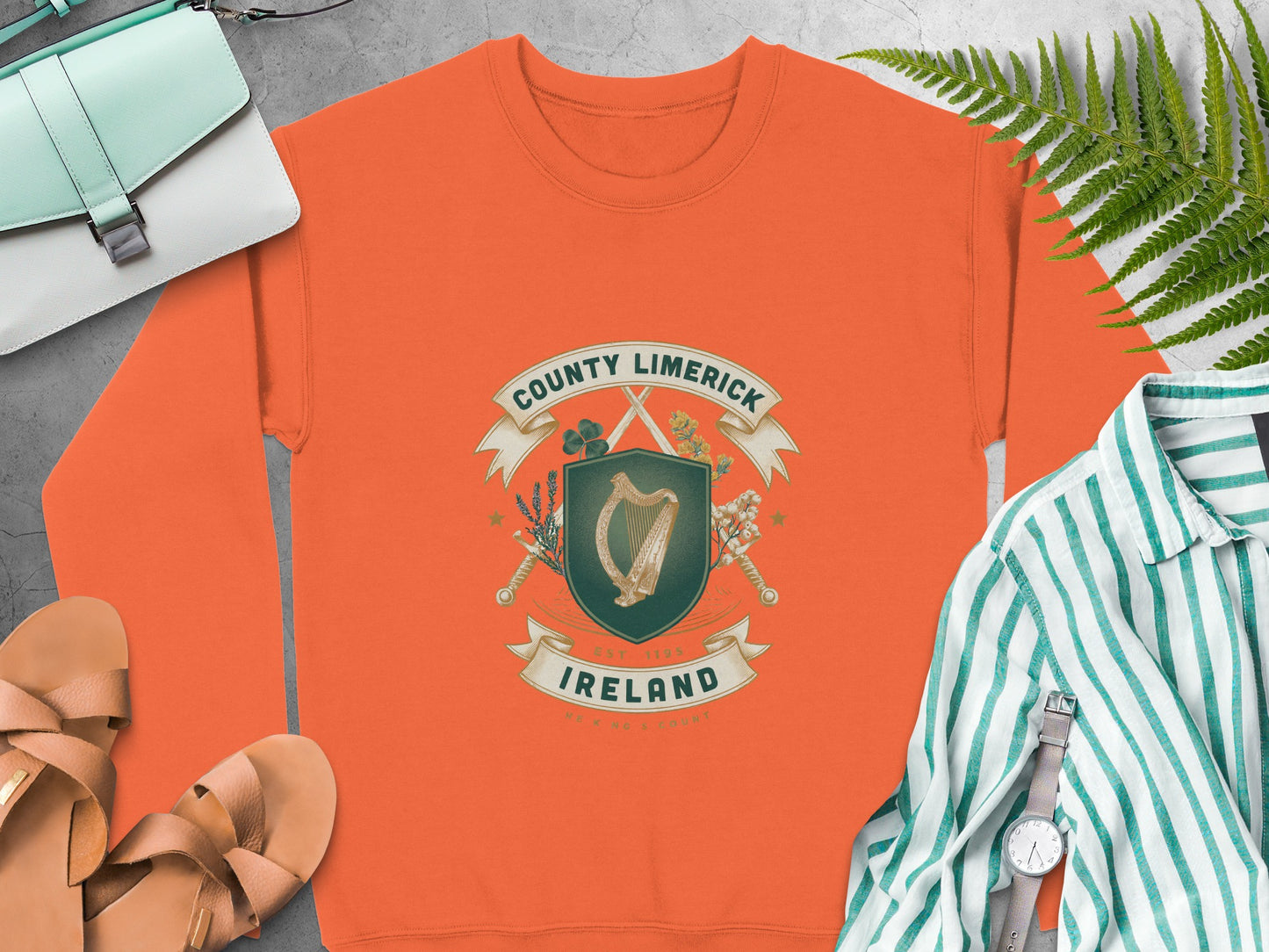 Orange sweatshirt with County Limerick Ireland harp emblem and text.