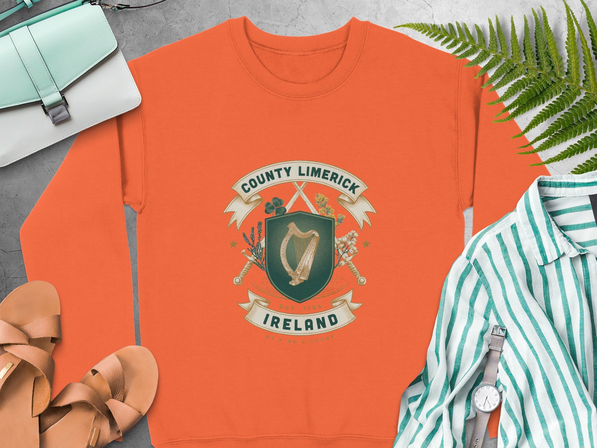Orange sweatshirt with County Limerick Ireland harp emblem and text.