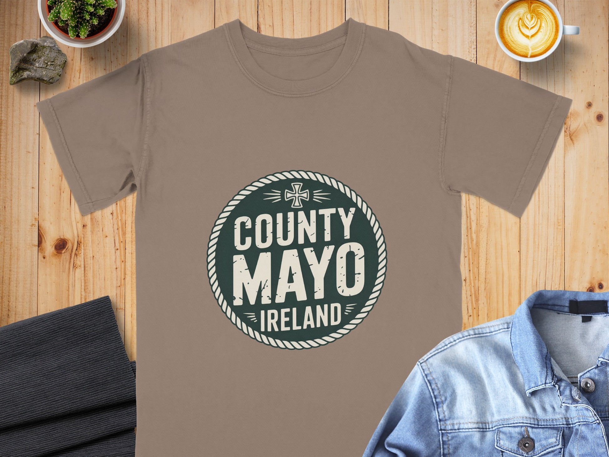 Brown t-shirt with a green circular design that reads "COUNTY MAYO IRELAND".