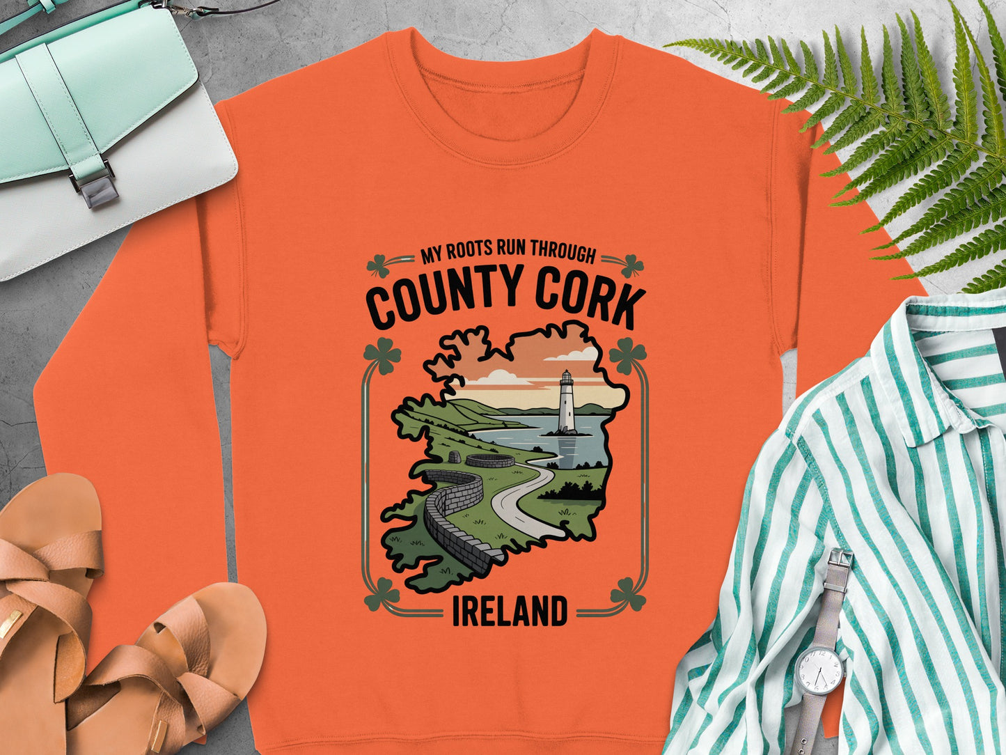 Orange sweatshirt with "County Cork Ireland" text and lighthouse graphic.