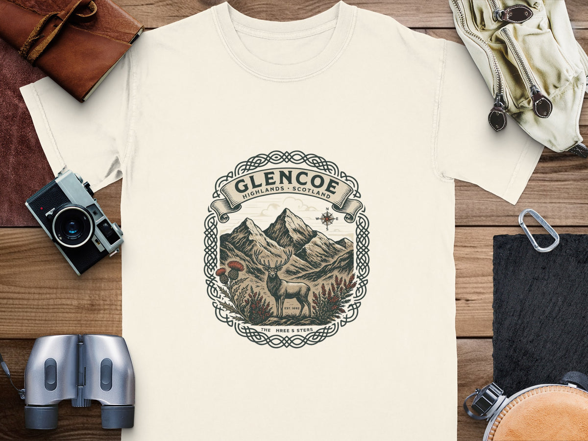 Glencoe Highlands Scotland graphic with stag, mountains, thistle, and compass rose.