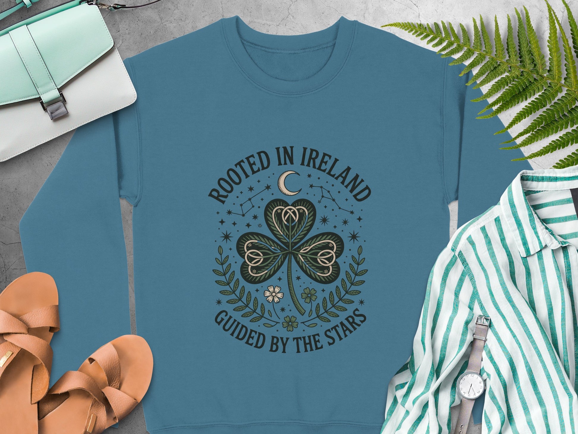 "Rooted in Ireland Guided by the Stars" and a shamrock on Indigo Blue sweatshirt