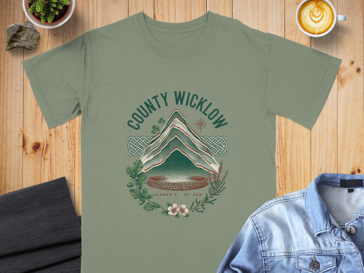 Green t-shirt with "COUNTY WICKLOW GARDEN O RE AND" mountain design.