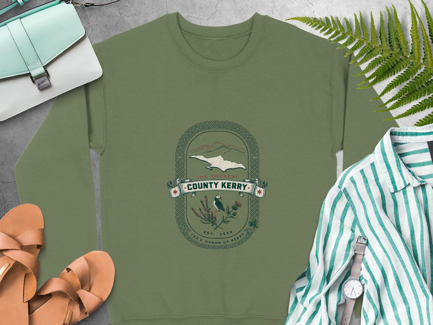 Green sweatshirt with "County Kerry" crest featuring puffin, thistle, and mountains.