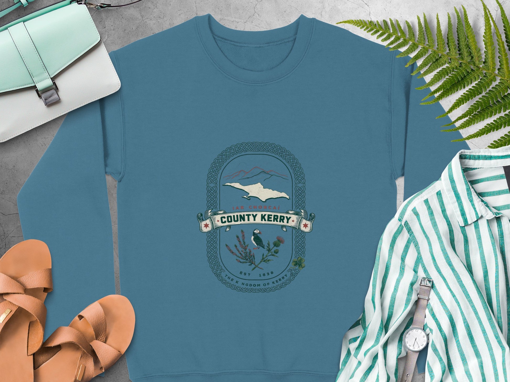 Blue crewneck sweatshirt with "County Kerry" crest featuring mountains, puffin, and shamrock.