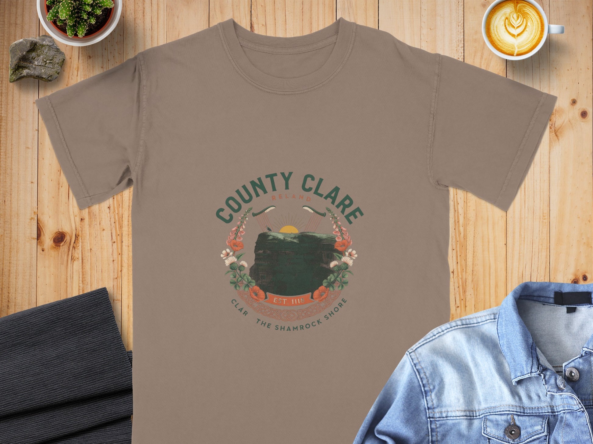 Brown t-shirt with "County Clare Ireland" graphic featuring a cliff and flowers.