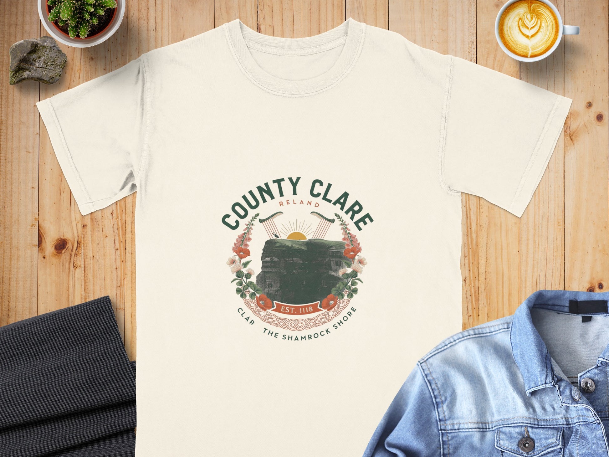 Cream t-shirt with "County Clare Ireland" circular emblem featuring cliffs and harp.