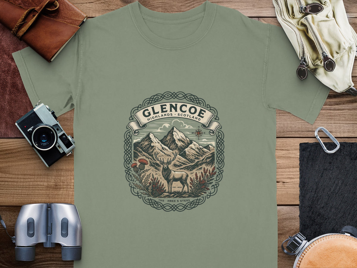 Glencoe Highlands Scotland graphic t-shirt with stag, mountains, and Celtic knot design.