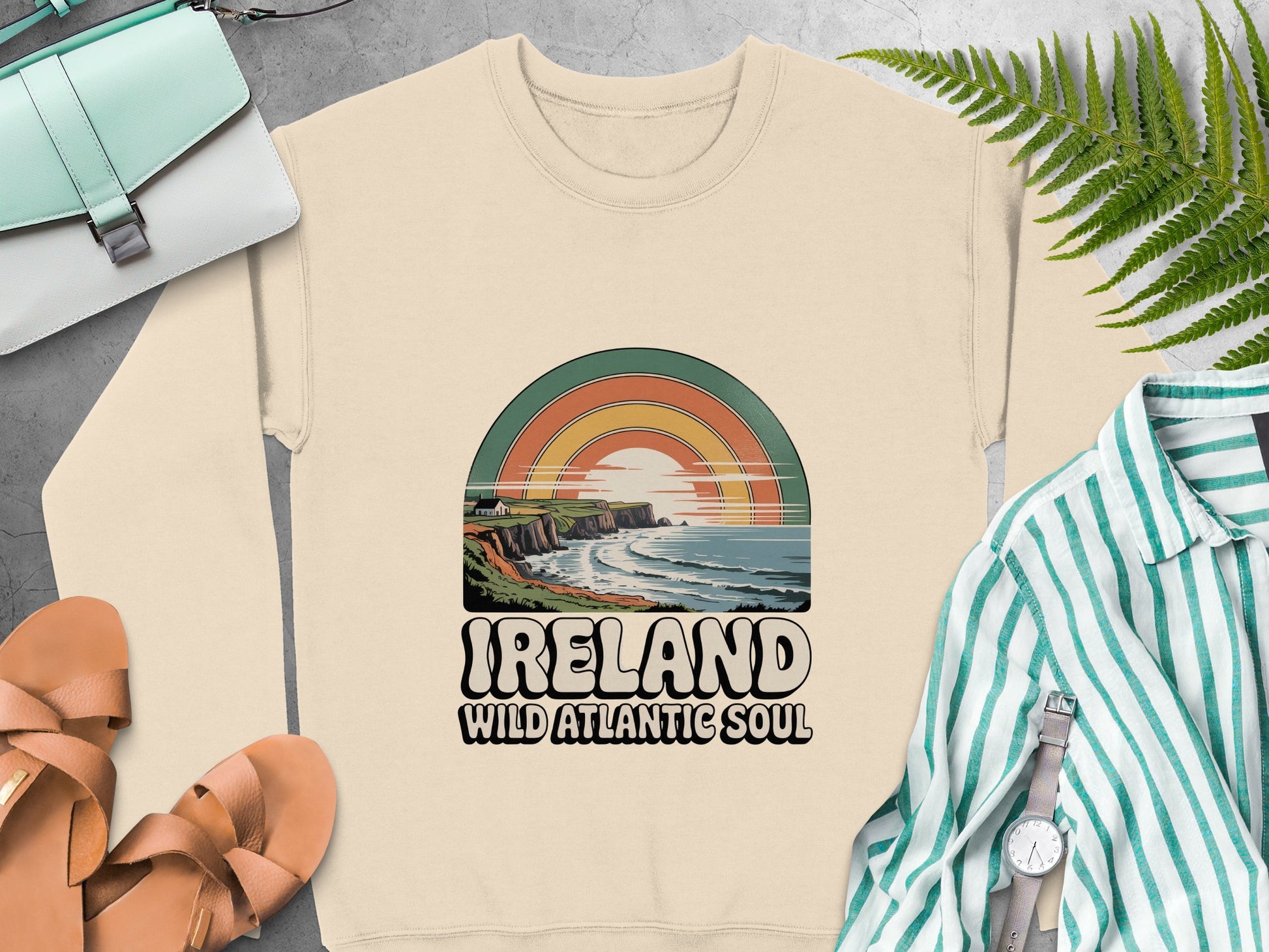 "Ireland Wild Atlantic Soul" text and a sunset over the ocean on Sand sweatshirt