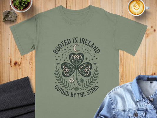 Green t-shirt with a shamrock design and text "Rooted in Ireland Guided by the Stars."