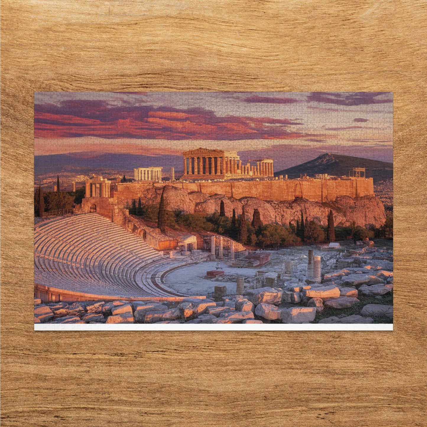 Acropolis of Athens with Theater of Dionysus in the foreground at sunset.