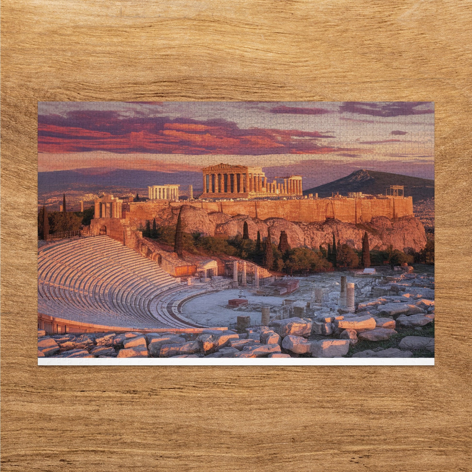 Acropolis of Athens with Theater of Dionysus in the foreground at sunset.