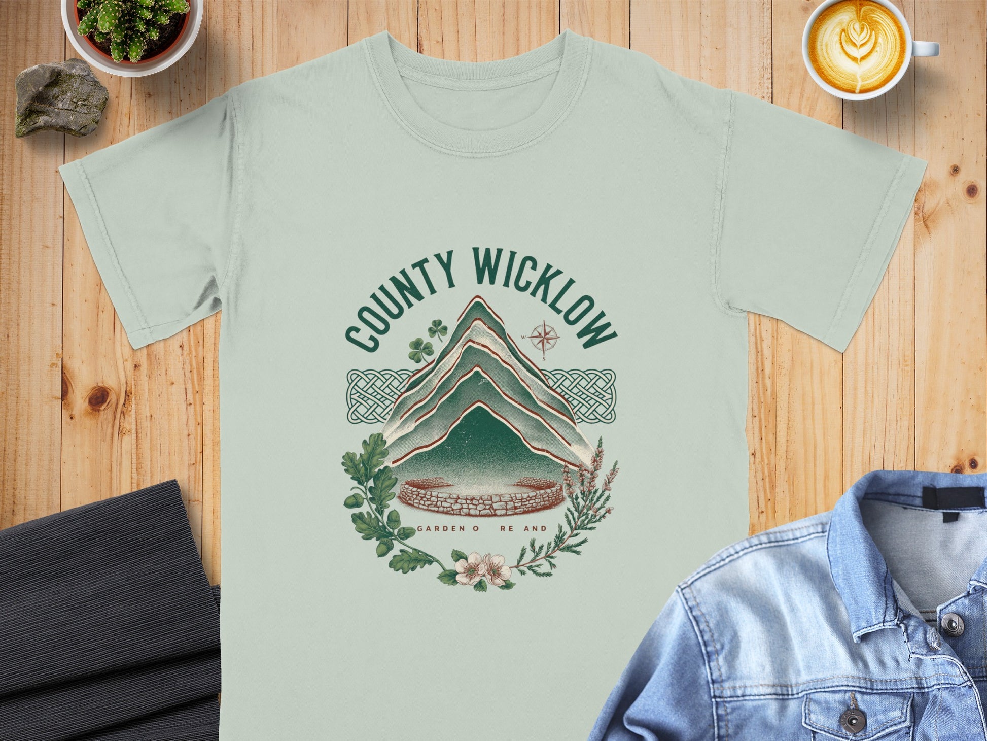 County Wicklow graphic on a light green t-shirt with stone ruins and foliage.