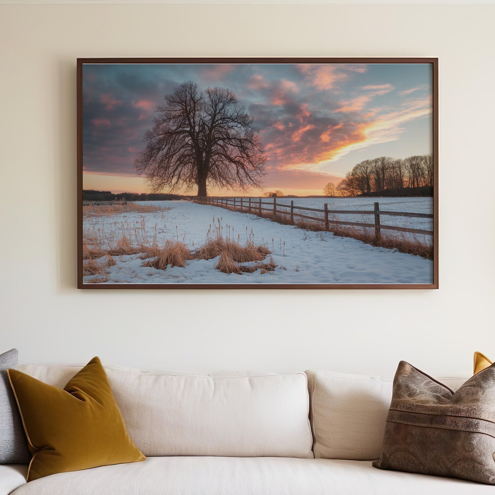 Framed landscape artwork of a large tree in a snowy field at sunset.
