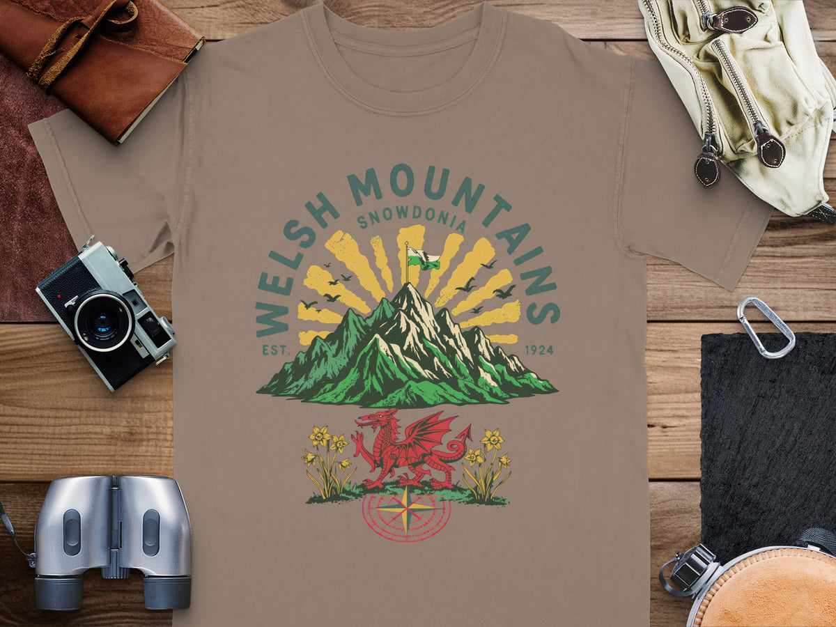 Welsh Mountains Snowdonia graphic with dragon, daffodils, and compass.
