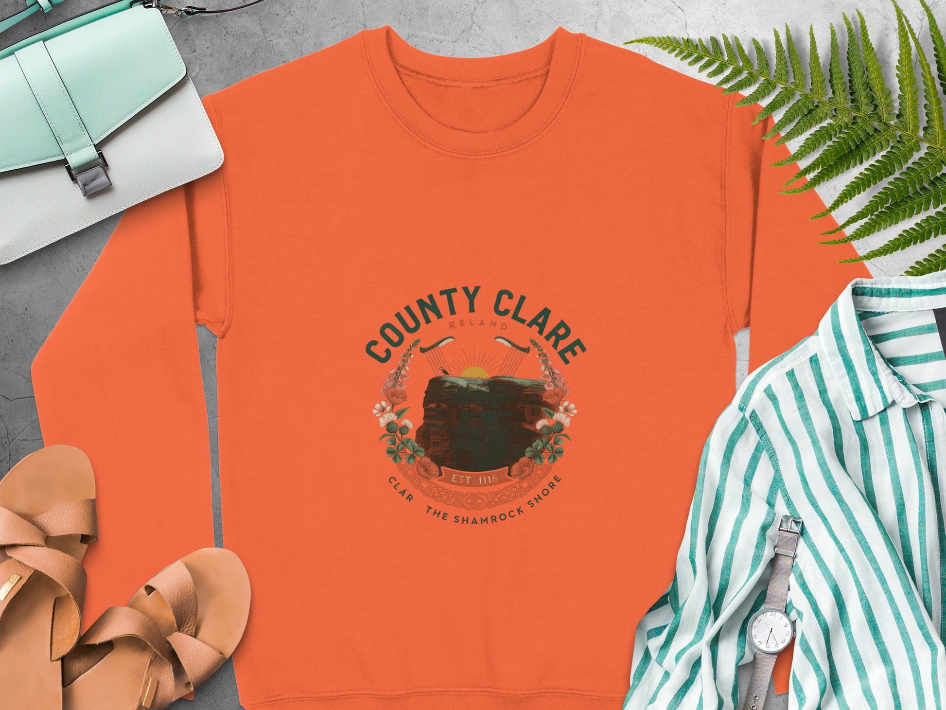 Orange sweatshirt with "County Clare Ireland" and a harp crest graphic.