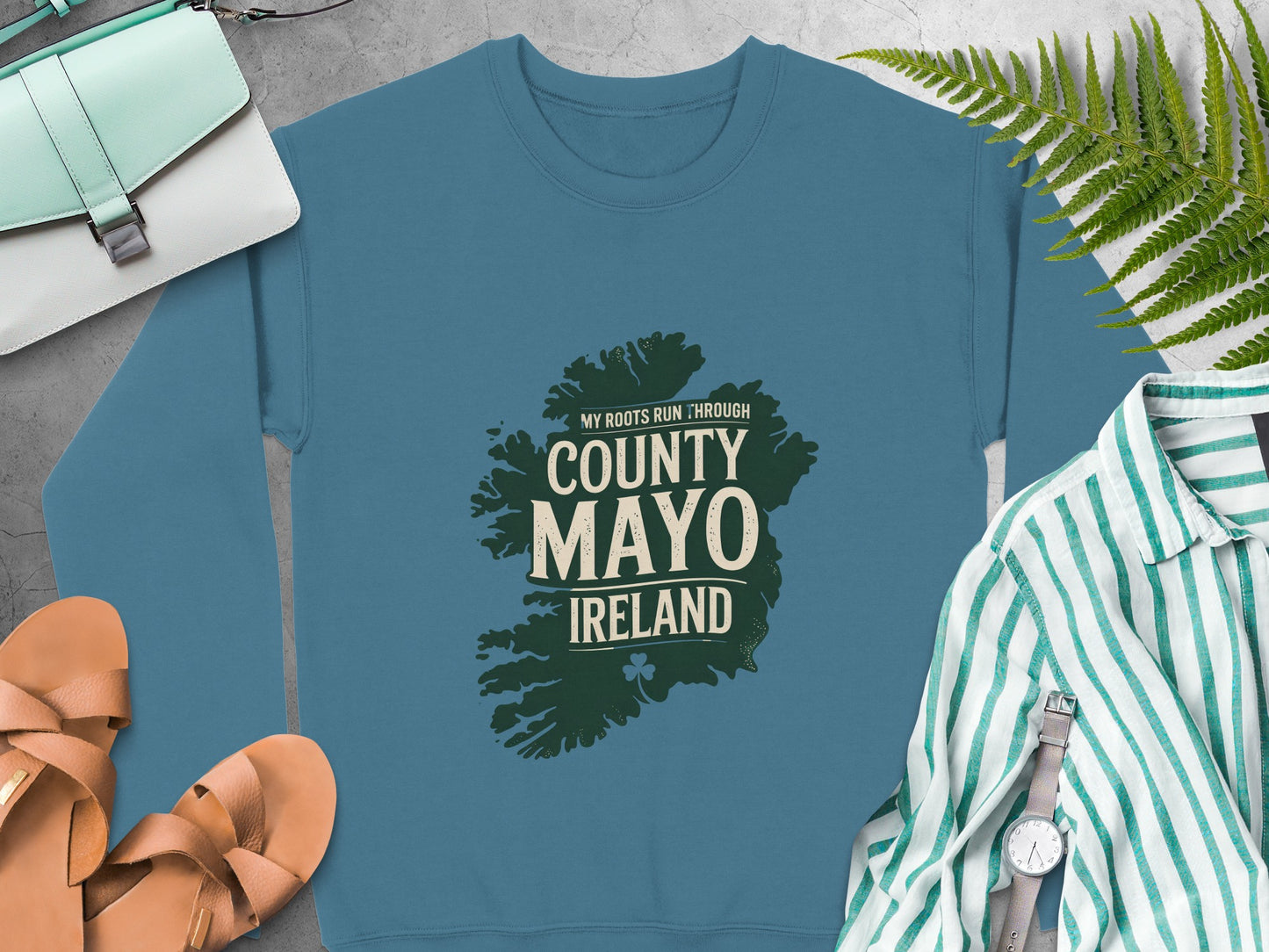 Teal sweatshirt with map of County Mayo, Ireland graphic and text.