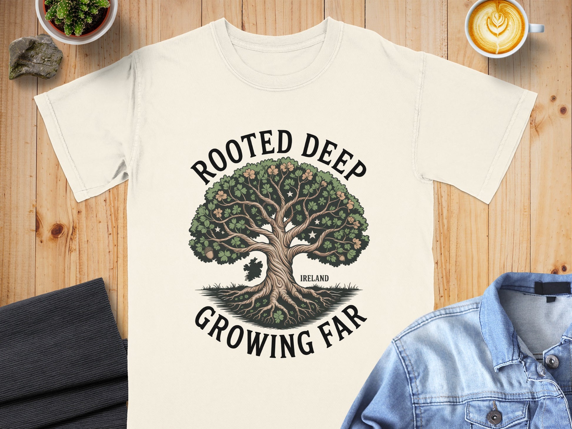 Cream t-shirt with "ROOTED DEEP GROWING FAR" and a tree with Ireland outline.