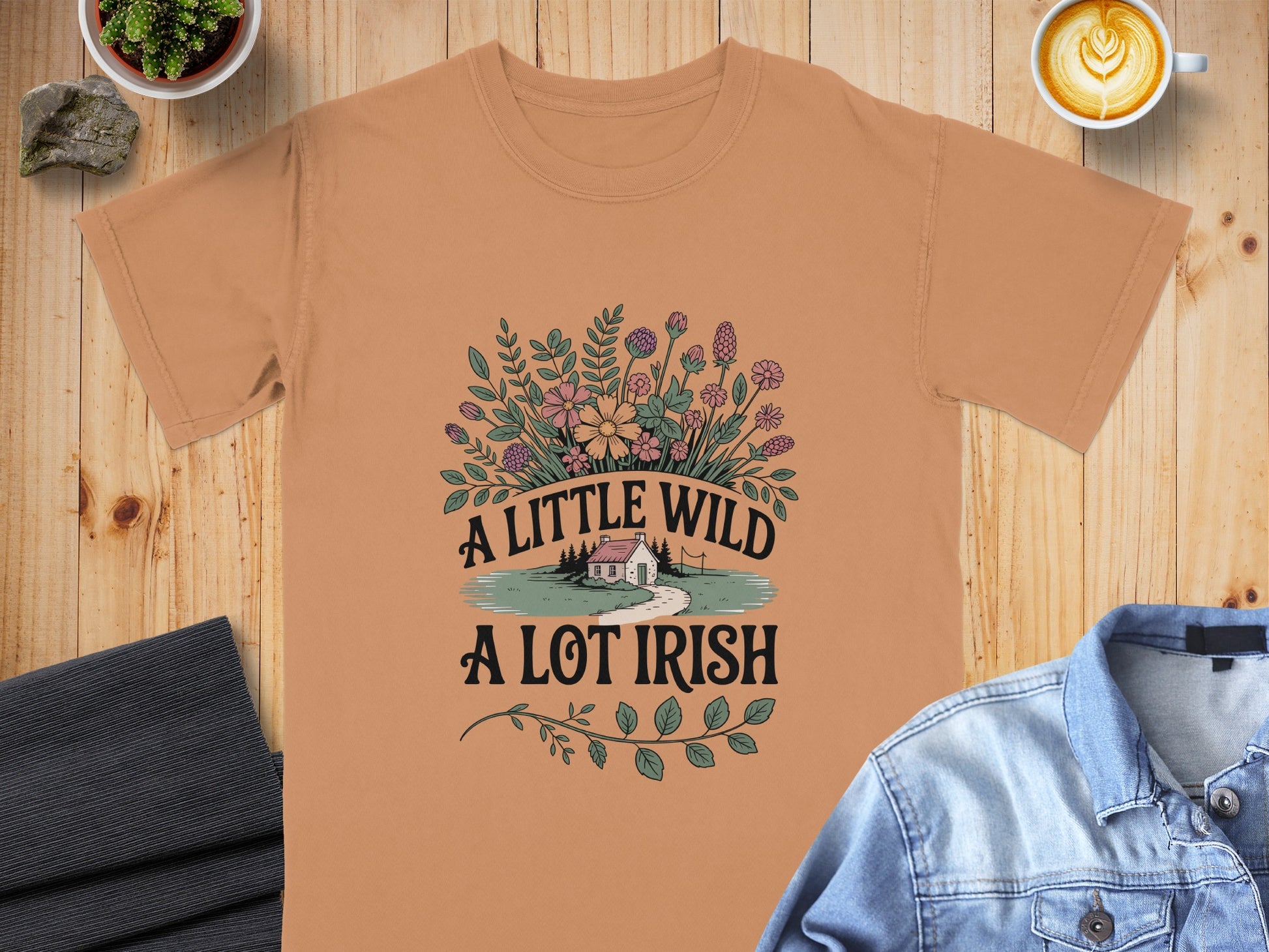Peach t-shirt with "A LITTLE WILD A LOT IRISH" text and floral design.