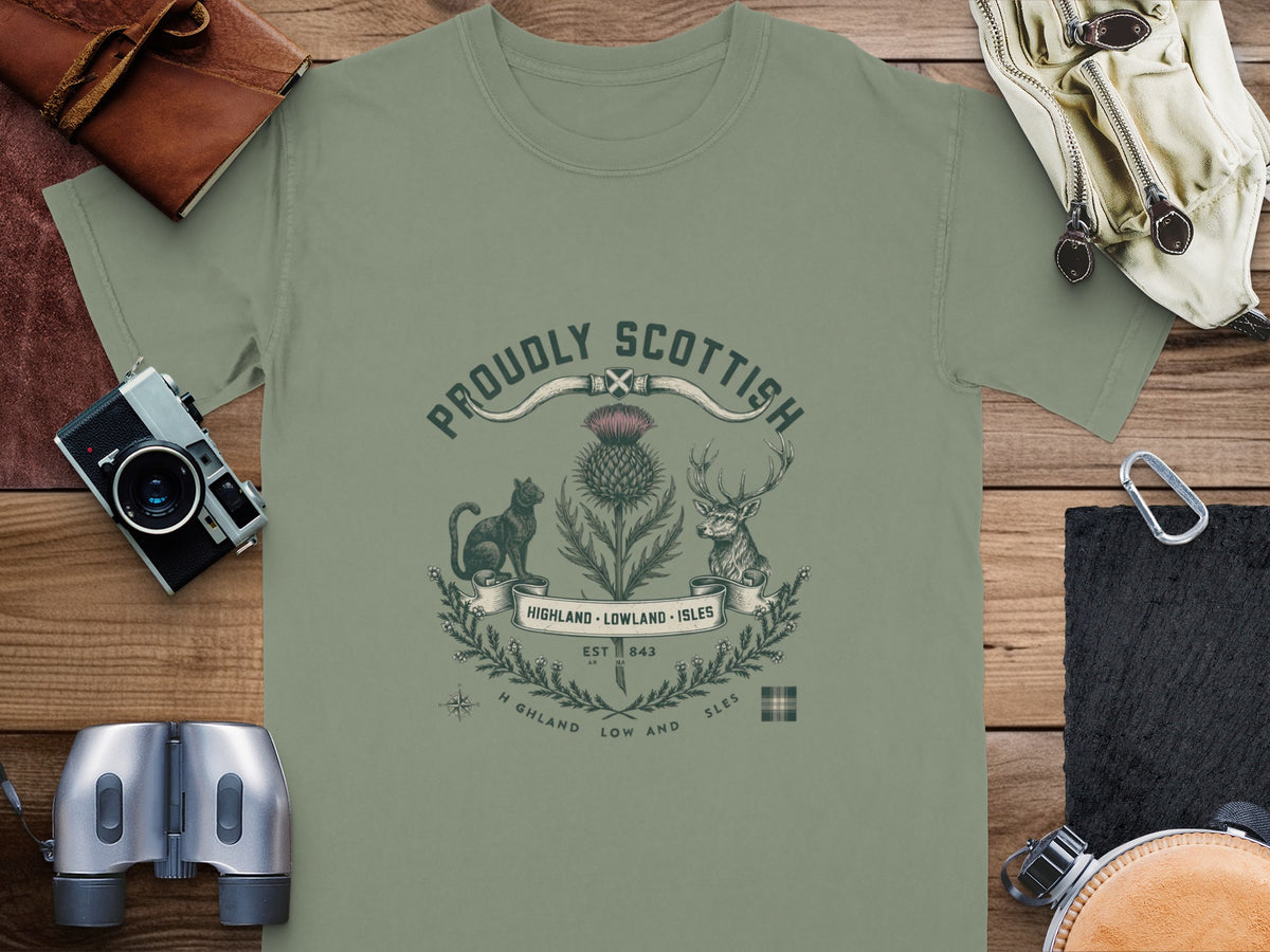 Olive green t-shirt with "Proudly Scottish" emblem featuring a thistle, cat, and deer.