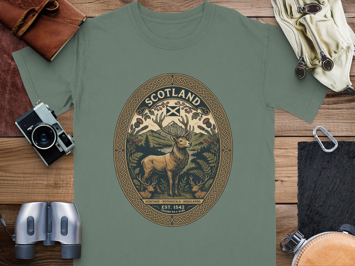 T-shirt with oval Scotland-themed graphic featuring a stag, mountains, and text "SCOTLAND EST. 1542".