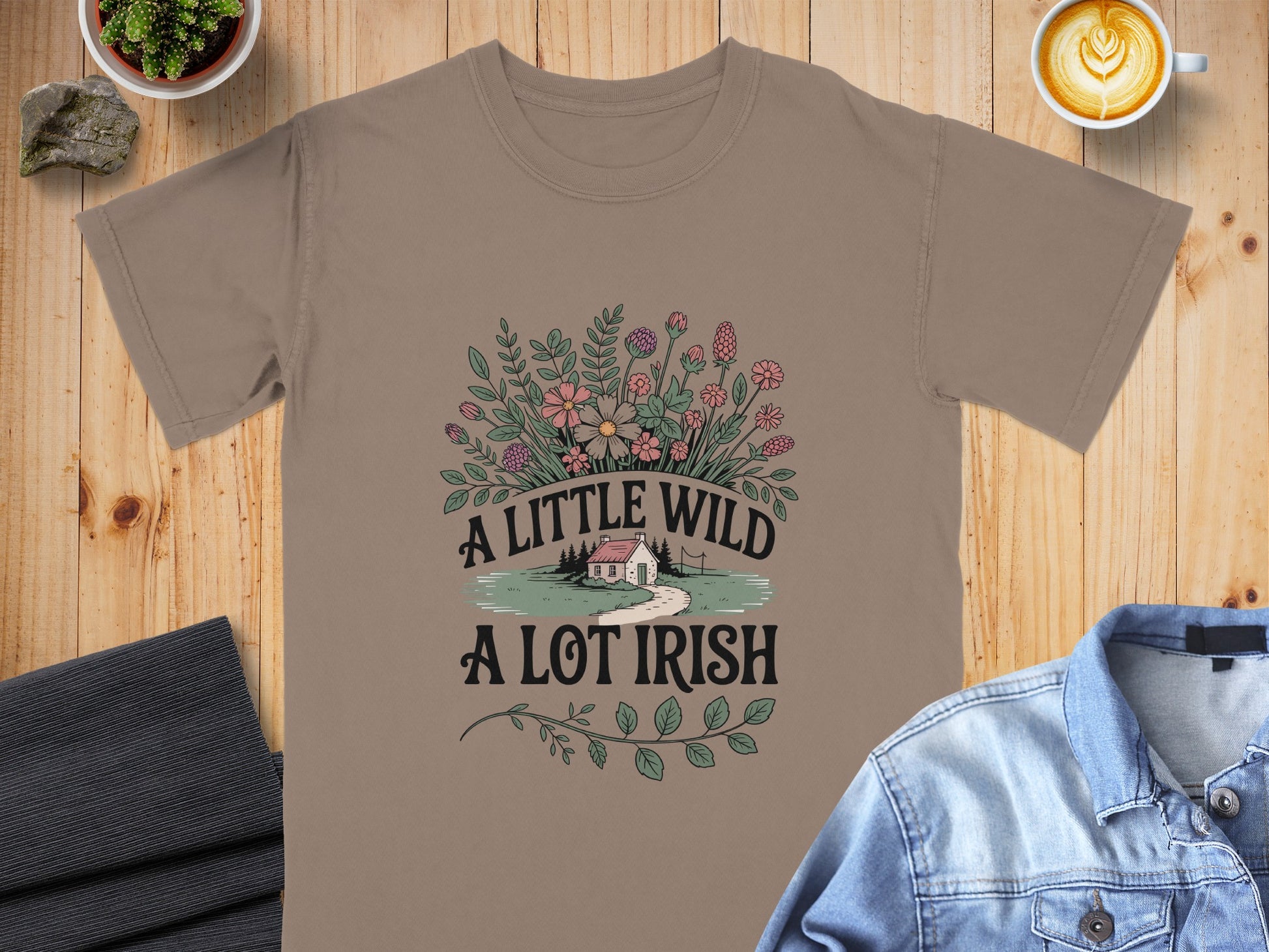 Brown t-shirt with "A LITTLE WILD A LOT IRISH" text and floral design.