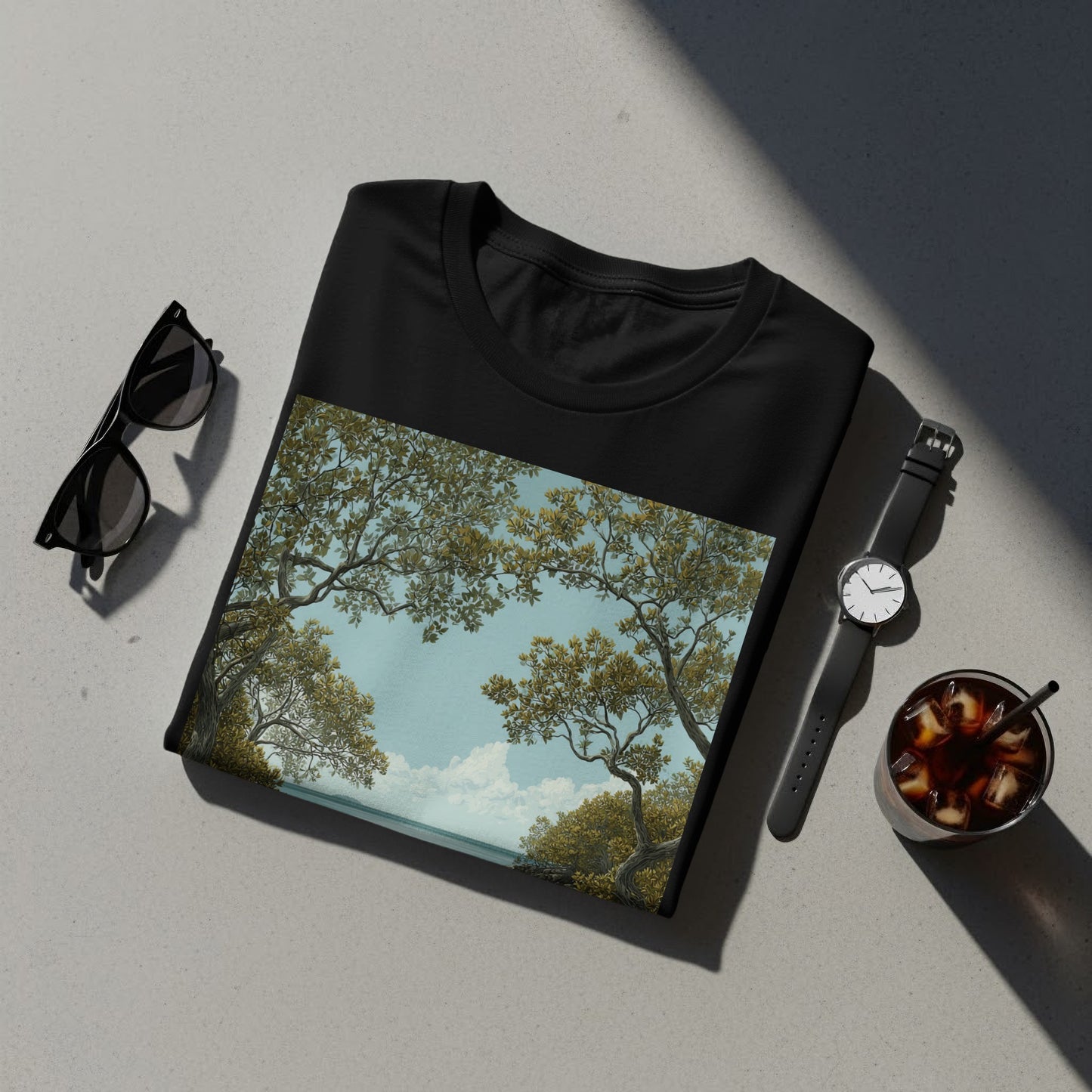Artistic Nature Scene on Black Folded T-Shirt Product