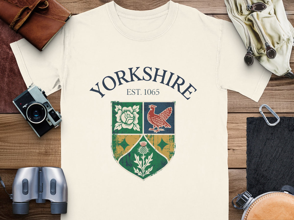 Cream t-shirt with "Yorkshire EST. 1065" and a crest featuring a rose, bird, and thistle.