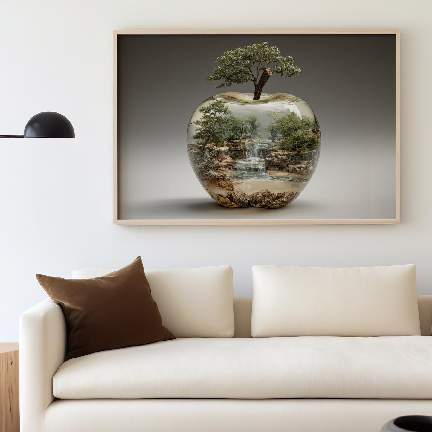 Framed artwork depicts a miniature forest landscape inside a clear apple.