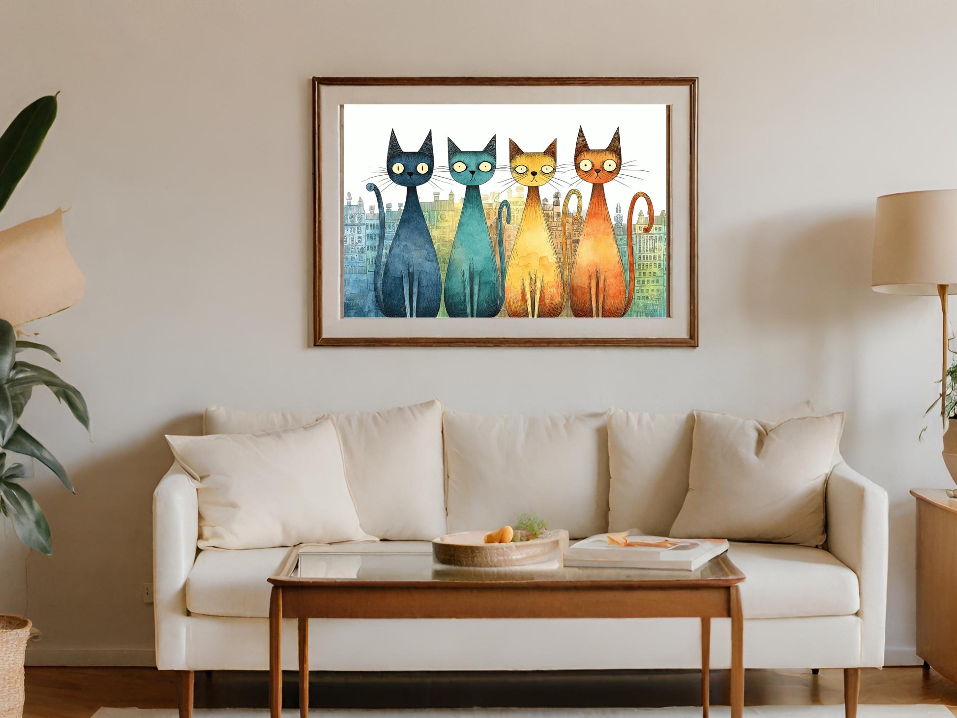 Four colorful cats in a row above a couch.